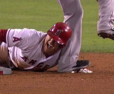 SEA@LAA: Trout gets spiked on the hand during slide