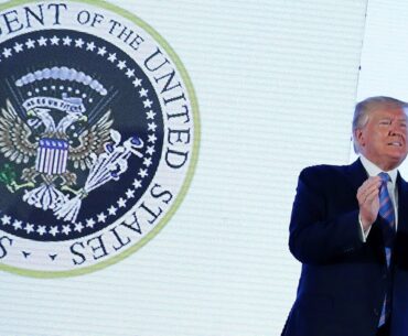 Donald Trump appears next to altered presidential seal featuring golf clubs and Russian eagle