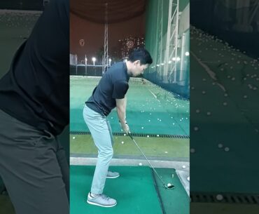 Golf swing.  waterfall golf range practice