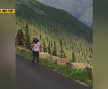 Glacier National Park visitors hit golf balls from Going-to-the-Sun Road