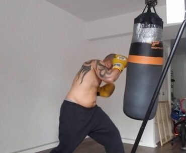 Wrapped up properly hitting heavy bag hard!