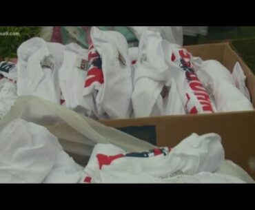 Veterans give out USS John McCain shirts