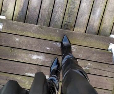 LadyIVE in shiny thigh high boots walks on the bridge