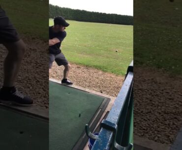 Lad bounces golf ball on the floor and then hits it