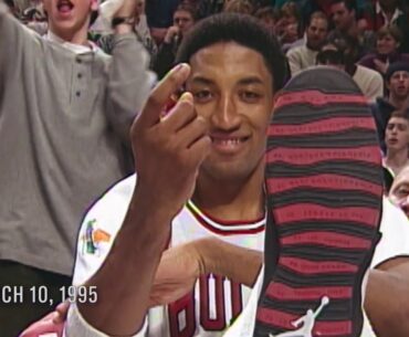 Scottie Pippen pulss Michael Jordan's shoe up