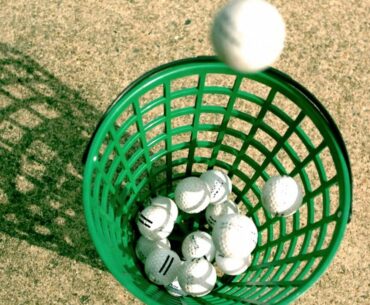 Golf Balls Slow Motion Dropping into Basket on Practice Driving Range taken in HD Video Slowmo View