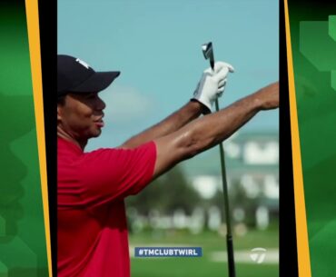 Tiger Woods demonstrates the finer points of twirling one's club after a good hit