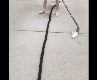 Off Ice: Stickhandling golf ball over rope (barefoot)