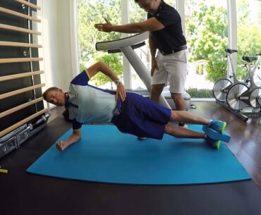 Ian Poulter and his personal trainer showing us how to do a side plank.