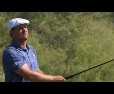 Bryson DeChambeau drives a par 4 with an iron