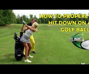 Swing Clinic:  Elise Lobb learns how to hit down on a golf ball