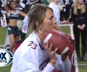 Girl wins $100,000 throwing football with two hands