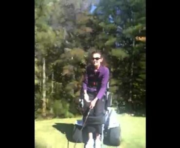 Beautifull paraplegic lady standing up and playing Golf