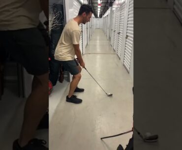 Dude tees off in storage facility and breaks exit sign.  Golf tee off.  Best long drive ever.