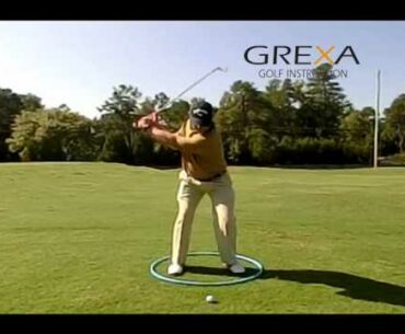 Golf swing drill - swinging in a barrel - slow motion