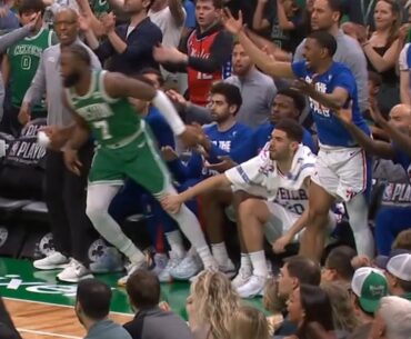 Georges Niang grabs Jaylen Brown's leg from the bench to stop him in Game 7