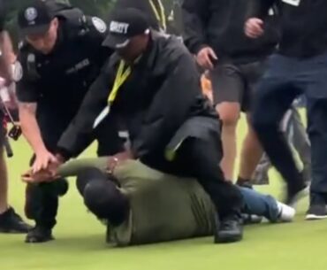 adam hadwin tackled by security while trying to celebrate Nick Taylor's win