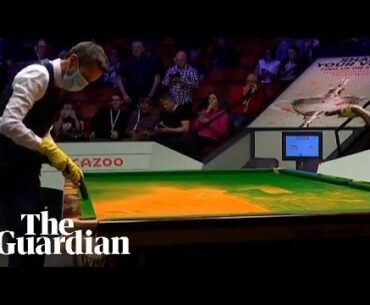 Commentator Rob Walker vacuum cleans snooker table after Just Stop Oil protest