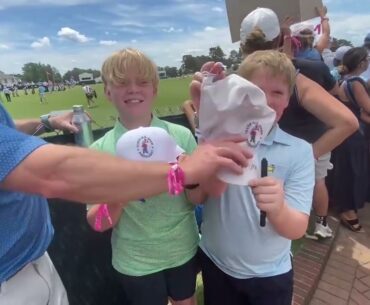 Max Homa and Jordan Spieth sign autographs near the range at No. 2