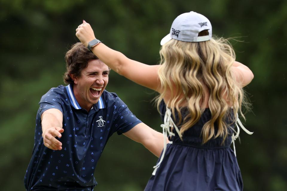 Nico Echavarria of Colombia celebrates with his girlfriend after winning the tournament on the 18th green during the final round of the Zozo Championship 2024 at Accordia Golf Narashino Country Club on October 27, 2024 in Inzai, Chiba, Japan. (Photo by Lintao Zhang/Getty Images)