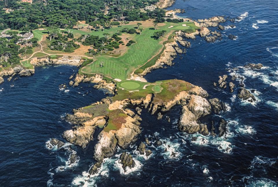 An aerial view of Pebble Beach golf course along rocks and ocean