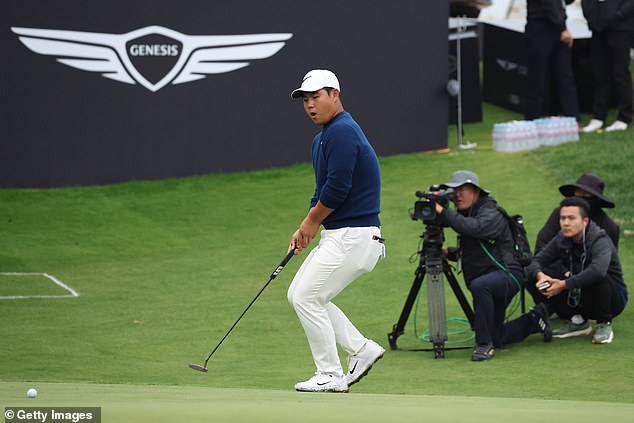 The 22-year-old reacts to missing a putt on the 18th green during Sunday's final round