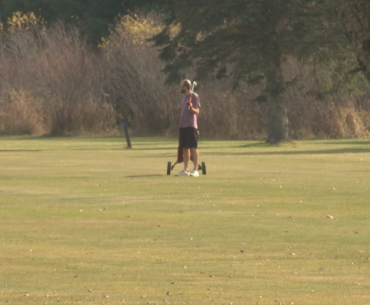 Golfers enjoy the fair weather on the fairway to end the golf season