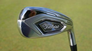 titleist t400 iron with grass background