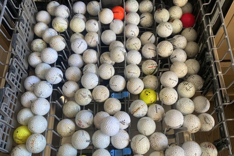 OK to put golf balls in dishwasher while wife is away on her golf trip?